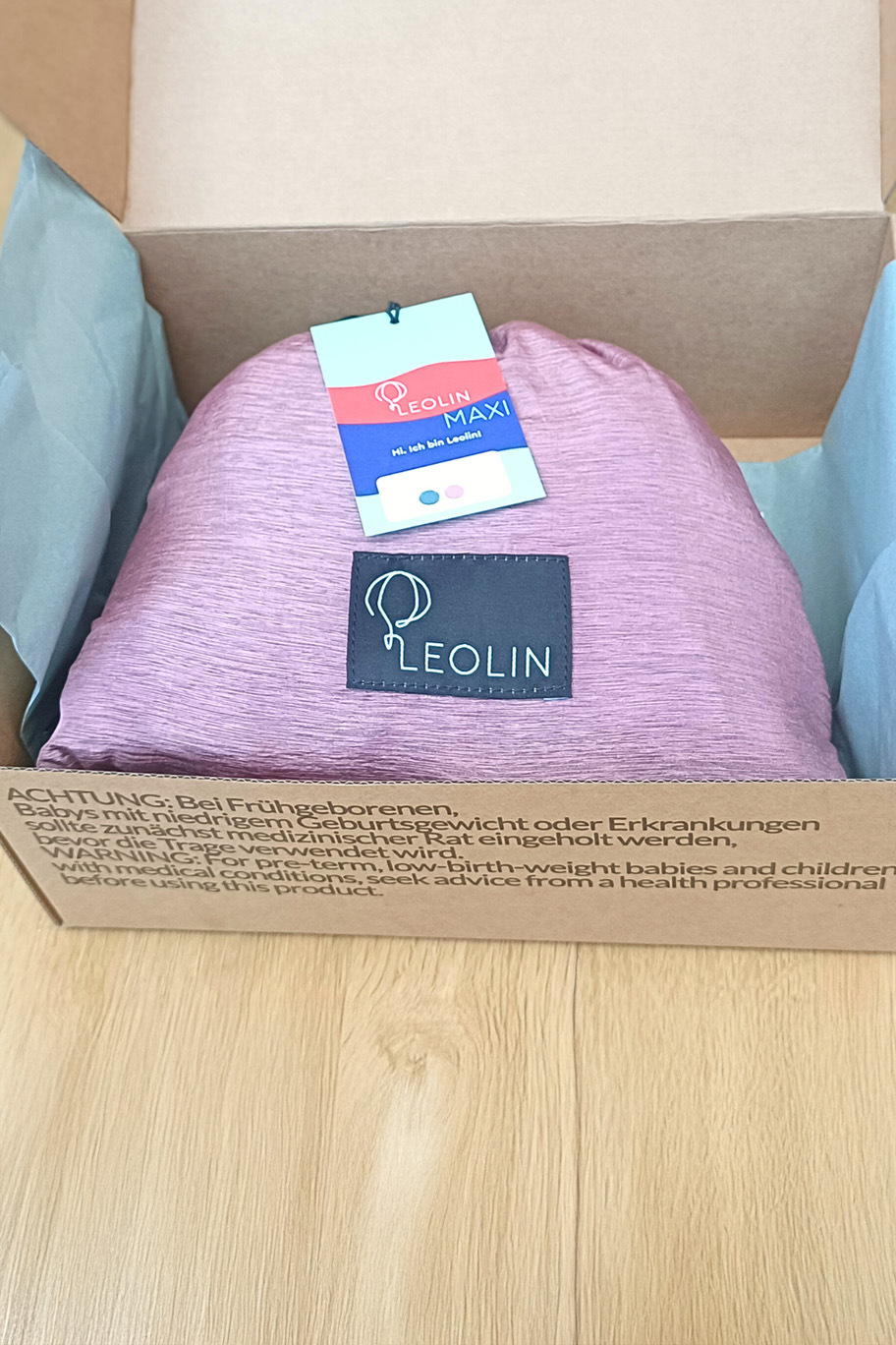 Verpackung von Babytrage Leolin Maxi Powder Melange